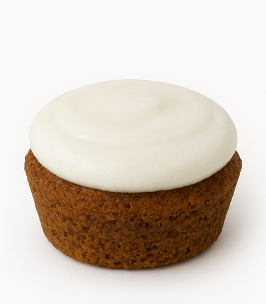 Beef pup cake with white yogurt icing on a white background